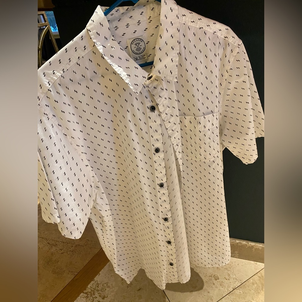 Simple black and white cotton, short sleeved men’s shirt.